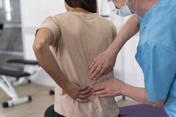 medical-assistant-helping-patient-with-physiotherapy-exercises-scaled.jpg